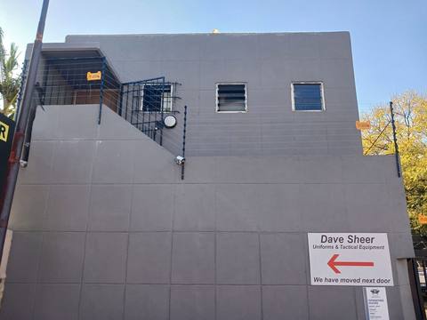 Electric fencing installed along the top of a building perimeter wall